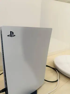 a white laptop computer sitting on top of a desk at Hotel Beswe in Tokyo