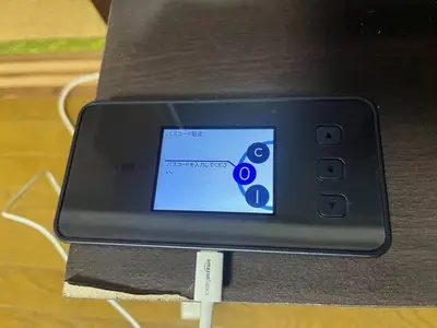 a cell phone sitting on top of a table at Tokyo Stay Nishishinjuku in Tokyo