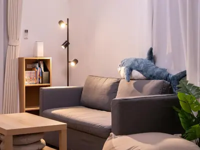 a stuffed animal is sitting on the back of a couch at GH8197 Newly Designed Home with All Modern Conveniences in Tokyo
