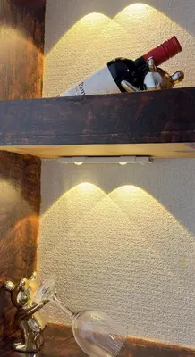 a wooden shelf with a glass heart on it at ManOku in Tokyo