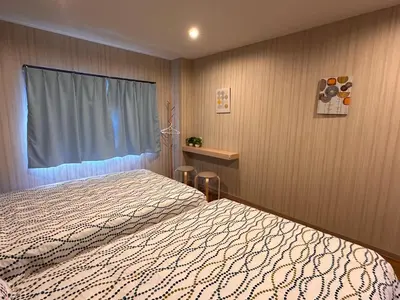 a bedroom with a bed and a window at VanillaHotel-Fukagawa in Tokyo
