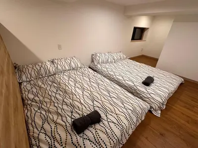 a bedroom with two beds in a room at VanillaHotel-Fukagawa in Tokyo