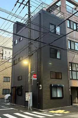 a building with a street light in front of it at VanillaHotel-Fukagawa in Tokyo