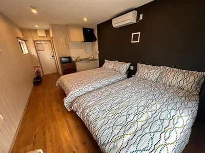 a bedroom with a large bed in a room at VanillaHotel-Fukagawa in Tokyo