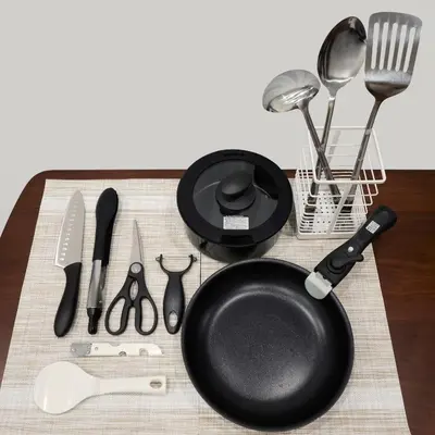 a frying pan and utensils on a table at LIFE TOWN Yotsugi in Tokyo