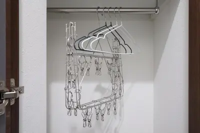 a bunch of hooks hanging in a closet at LIFE TOWN Yotsugi in Tokyo