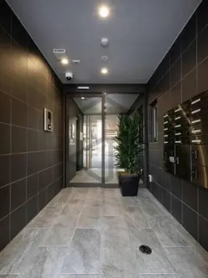 a hallway of a building with a potted plant at incense\u4e0a\u91ce\u6839\u5cb82\uff26 in Tokyo