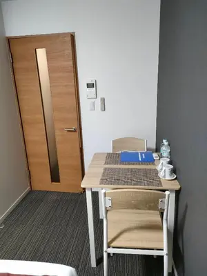 an office desk with a door and a table and chairs at incense\u4e0a\u91ce\u6839\u5cb86\uff26 in Tokyo