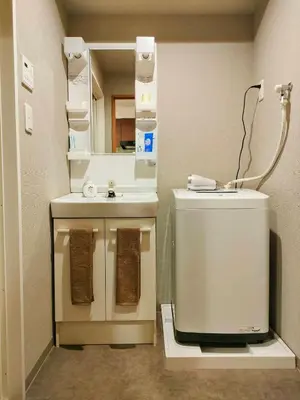a bathroom with a toilet and a mirror at incense\u4e0a\u91ce\u6839\u5cb86\uff26 in Tokyo