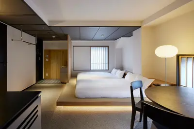 a hotel room with a bed and a table at Minn Asakusa Kuramae North in Tokyo