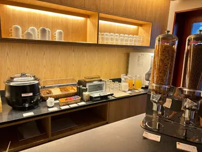 a kitchen with a counter with food and a blender at Minn Asakusa Kuramae North in Tokyo