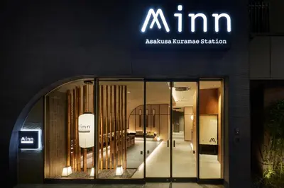 a store front with a sign on the side of a building at Minn Asakusa Kuramae Station in Tokyo