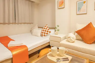 a small room with two beds and a table at Higashi-Nakano 103 train 2 stops to Shinjuku ,up to 3 people in Tokyo