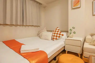 a small room with a bed and a chair at Higashi-Nakano 203 train 2 stops to Shinjuku ,up to 3 people in Tokyo