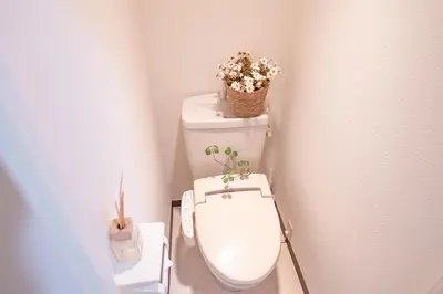a bathroom with a toilet with a plant on it at Higashi-Nakano 203 train 2 stops to Shinjuku ,up to 3 people in Tokyo