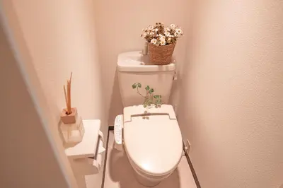 a bathroom with a toilet with flowers on top of it at Higashi-Nakano 203 train 2 stops to Shinjuku ,up to 3 people in Tokyo