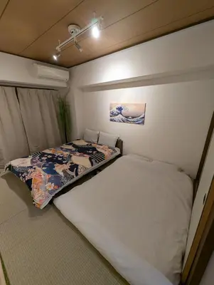 a small bedroom with a bed in a trailer at Asakusa Tokyo T'sRoom in Tokyo
