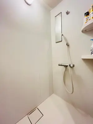 a shower in a white bathroom with a mirror at Year-end promotion Free Wi-Fi spacious and bright Closs Ueno 1min to Minowa Sta Wide Room Max 4People in Tokyo