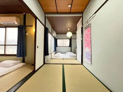 a room with two beds and a room with at NakakasaiKodateNKK1 in Tokyo
