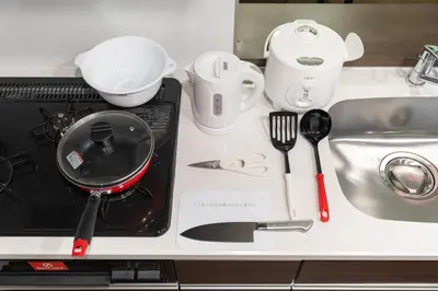a counter top with a kitchen utensils and a sink at The Parkcross\u4e21\u56fd\u7dd1 in Tokyo