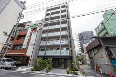 a tall building in a city with buildings at The Parkcross\u4e21\u56fd\u7dd1 in Tokyo