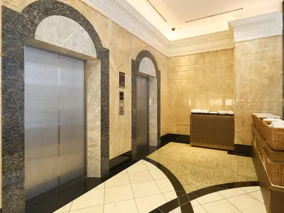 a bathroom with a shower stall and a door at The OneFive Tokyo Kameido in Tokyo
