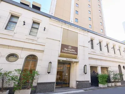 a building with a sign on the front of it at The OneFive Tokyo Kameido in Tokyo
