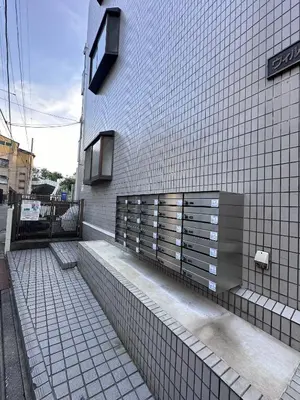 a building with white tiles on the side of it at Aakabane Apart ment 3 Wei hefuyan7190 in Tokyo