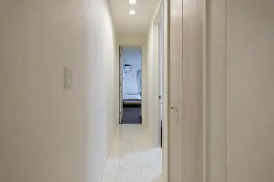 a hallway leading to a bedroom in a house at UN-Villa in Tokyo