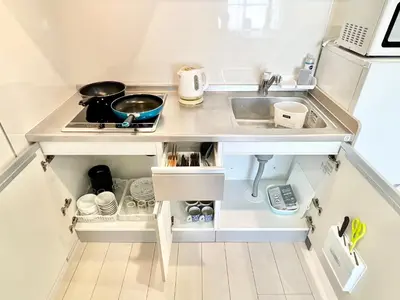 a small kitchen with a sink and a stove at 君の家AOTO#Haneda&Narita Access#Free reserved parking in Tokyo