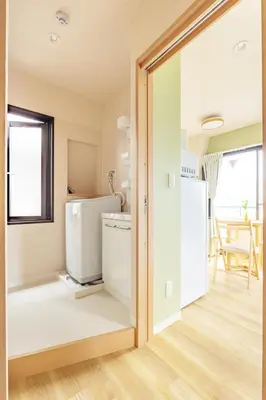 a laundry room with a washer and dryer at Shinjuku Waseda Haruno B&B in Tokyo