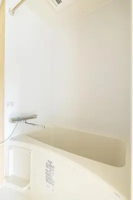 a white tub in a bathroom with a faucet at Shinjuku Waseda Haruno B&B in Tokyo