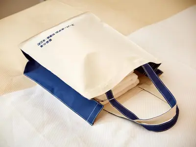 a paper bag sitting on top of a table at Super Hotel Akihabara Suehirocho in Tokyo