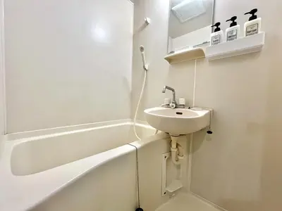 a white bathroom with a sink and a bath tub at S,F, Heights - Vacation STAY 18008 in Tokyo