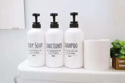 four bottles of laundry detergents sitting on a shelf at Heisei Mansion - Vacation STAY 18017 in Tokyo