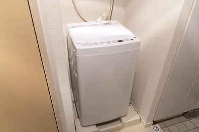 a small white refrigerator in the corner of a room at SQUARE Shibuya Room 901 - Vacation STAY 57159v in Tokyo
