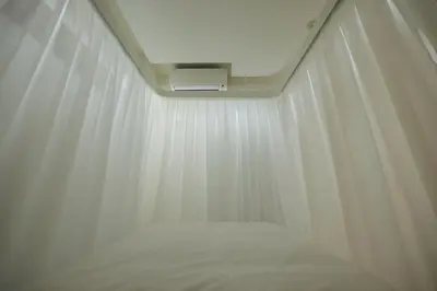 a bed in a room with a white curtain at SQUARE Shibuya Room 901 - Vacation STAY 57159v in Tokyo