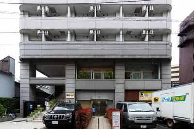a building with two cars parked in front of it at SQUARE Shibuya Room 901 - Vacation STAY 57159v in Tokyo