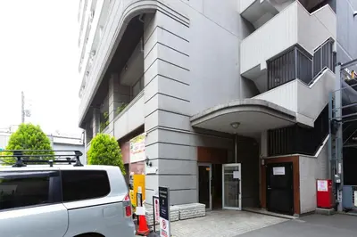 a white van parked in front of a building at SQUARE Shibuya Room 901 - Vacation STAY 57159v in Tokyo