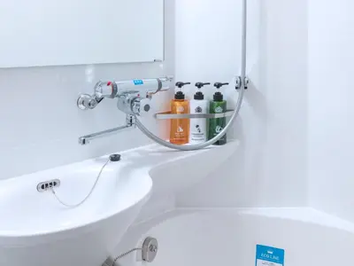 a bathroom with a sink and a mirror at APA Hotel Akabane Iwabuchi Ekimae in Tokyo