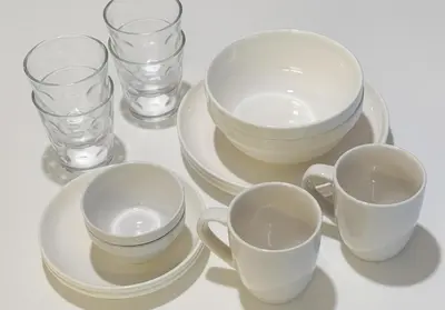 a group of cups and plates and glasses on a table at Higashi-Shinjuku 902 in Tokyo