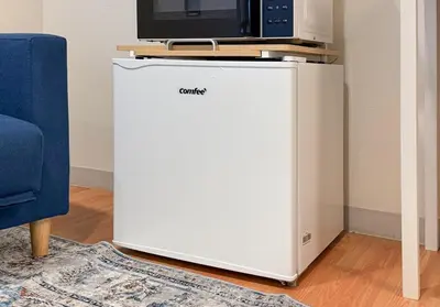 a white refrigerator with a tv on top of it at Higashi-Shinjuku 902 in Tokyo