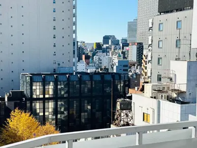 a view of a city skyline with tall buildings at Higashi-Shinjuku 14F in Tokyo