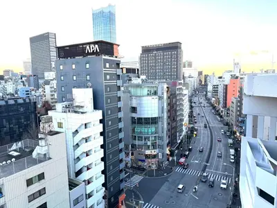 a view of a city street with buildings at Higashi-Shinjuku 14F in Tokyo