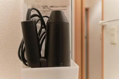 a black router sitting on top of a shelf at Alba cerezo by Tranova in Tokyo