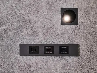 a digital clock on top of a concrete wall at HOTEL ALL IN TOKYO Asakusabashi in Tokyo