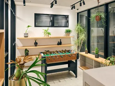 a game room with a foosball table and plants at HOTEL ALL IN TOKYO Asakusabashi in Tokyo