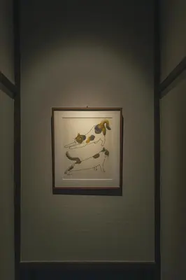 a framed picture of two dogs on a wall at innnn higashinagasaki in Tokyo