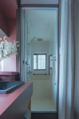 a bathroom with a shower with a glass door at innnn higashinagasaki in Tokyo