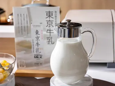 a jug of milk on a counter with a box at SUPER HOTEL Ikebukuro West Natural Hot Spring in Tokyo